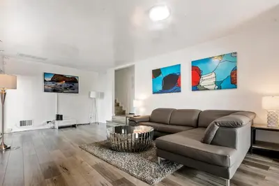 a living room with a couch and a table at 4 bedroom and 3 bath home close to universal studio and Hollywood in Sherman Oaks