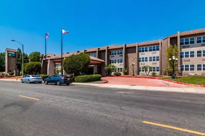 an empty street in front of a large building at Holiday Inn Express & Suites Camarillo by IHG in Camarillo