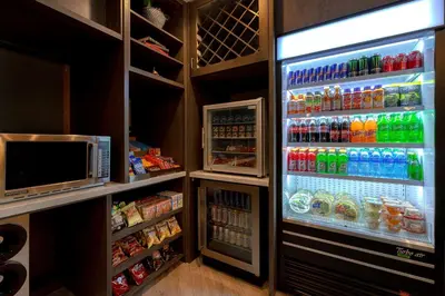 a refrigerator filled with lots of drinks and a microwave at Doubletree By Hilton Palmdale, Ca in Palmdale
