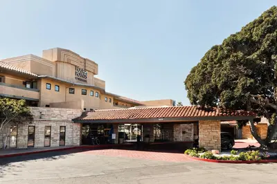 an exterior view of a hotel with a building at Four Points by Sheraton Ventura Harbor Resort in Ventura