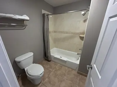 a bathroom with a toilet and a bath tub at Studio 6 Mojave, CA - Airport in Mojave