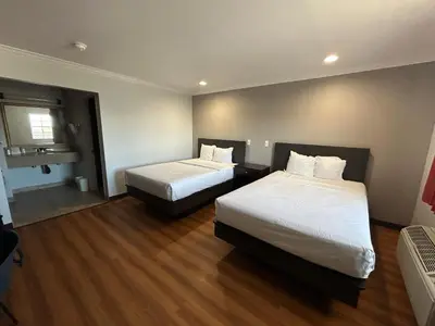 a hotel room with two beds and a window at Studio 6 Mojave, CA - Airport in Mojave