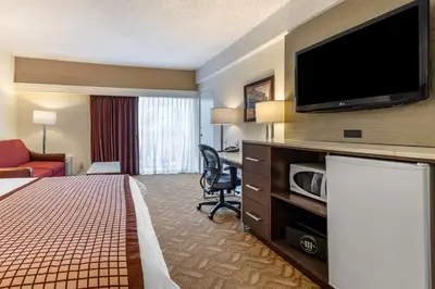 a hotel room with a bed and a flat screen tv at Best Western Plus Thousand Oaks Inn in Thousand Oaks