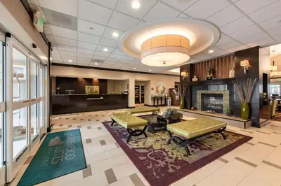 a lobby with a fireplace and a living room at Homewood Suites by Hilton Oxnard/Camarillo in Oxnard