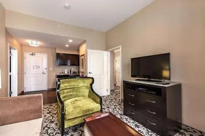 a living room with a flat screen tv and a couch at Homewood Suites by Hilton Oxnard/Camarillo in Oxnard