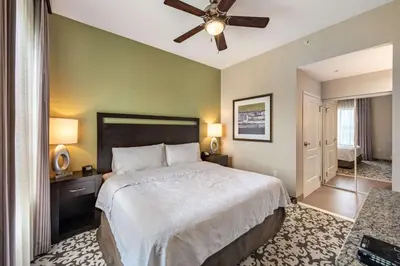 a bedroom with a bed and a ceiling fan at Homewood Suites by Hilton Oxnard/Camarillo in Oxnard