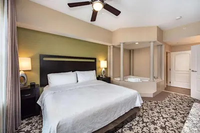 a bedroom with a large bed and a ceiling fan at Homewood Suites by Hilton Oxnard/Camarillo in Oxnard