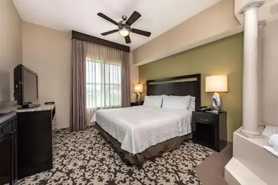 a hotel room with a bed and a television at Homewood Suites by Hilton Oxnard/Camarillo in Oxnard