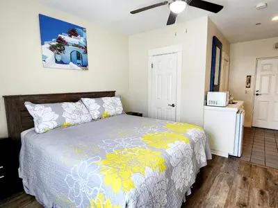 a bedroom with a bed and a ceiling fan at Santa Paula Inn in Santa Paula