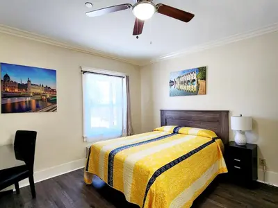 a bedroom with a bed and a ceiling fan at Santa Paula Inn in Santa Paula