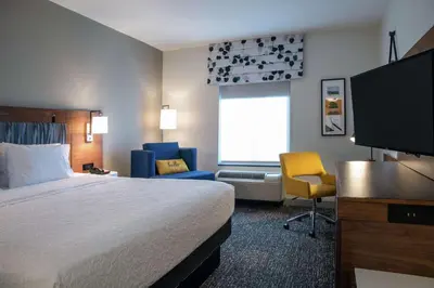 a hotel room with a bed and a flat screen tv at Hampton Inn & Suites Sherman Oaks in Sherman Oaks