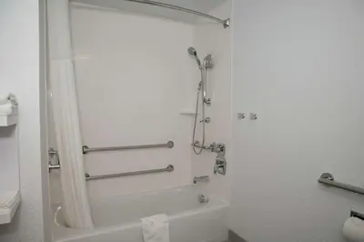 a bathroom with a shower and a bath tub at Hampton Inn & Suites Sherman Oaks in Sherman Oaks