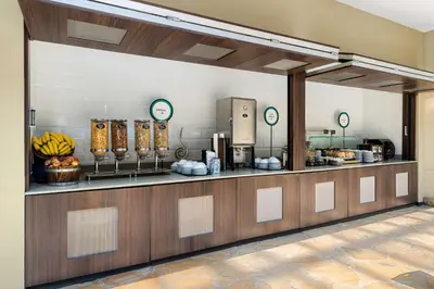 a kitchen with a counter with bananas on it at Embassy Suites by Hilton Los Angeles International Airport South in El Segundo