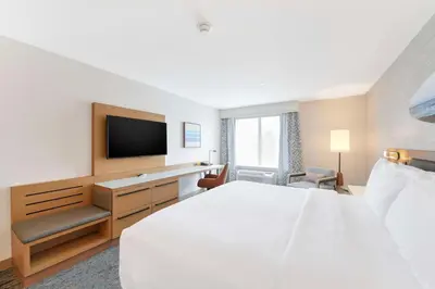 a hotel room with a bed and a flat screen tv at Hilton Garden Inn LAX - El Segundo in El Segundo