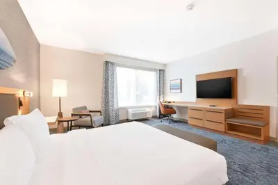 a hotel room with a bed and a desk at Hilton Garden Inn LAX - El Segundo in El Segundo