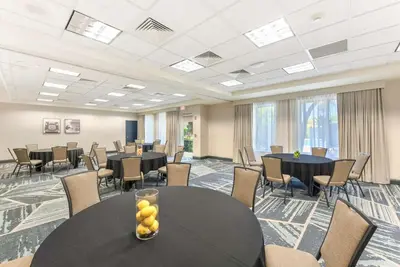 a conference room with round tables and chairs at Hilton Garden Inn LAX - El Segundo in El Segundo