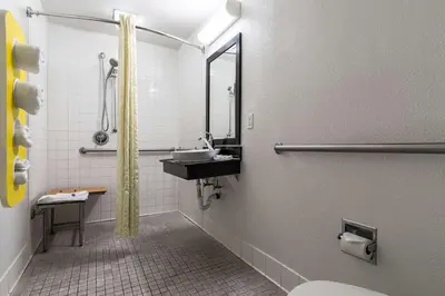 a bathroom with a sink and a mirror at Motel 6 Riverside, CA - UCR East in Riverside