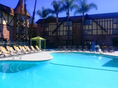 a large swimming pool in front of a hotel at Anaheim Majestic Garden Hotel in Anaheim