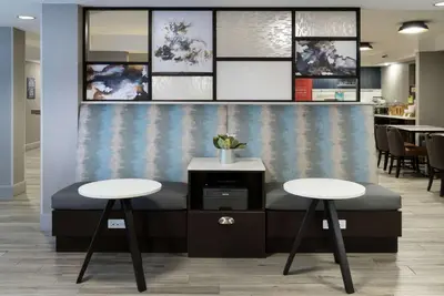 a waiting area with two tables in a office at Hampton Inn Los Angeles Santa Clarita in Santa Clarita