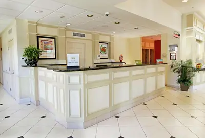 a lobby of a hospital with a reception counter at Hilton Garden Inn Oxnard/Camarillo in Oxnard