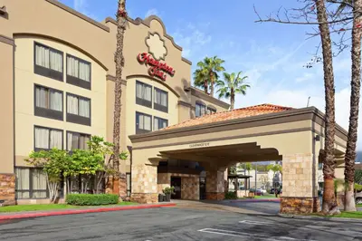 a hotel with a sign on the front of it at Hampton Inn Los Angeles/Arcadia in Arcadia