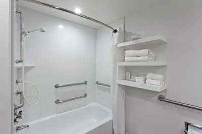 a white bathroom with a shower and a bath tub at Hampton Inn Los Angeles/Arcadia in Arcadia