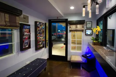 a restaurant with a door and a bench in a room at Regency Inn in Los Angeles in Los Angeles