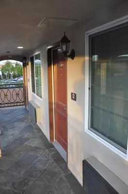 a front door of a house with a window at Sun Light Motel in Downey