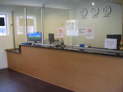 a cash counter with a computer on top of it at Eastsider Motel -Downtown LA New Rooms in Los Angeles
