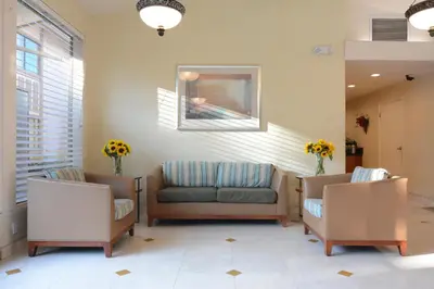 a waiting room with two chairs and a couch at Red Roof Inn San Dimas - Fairplex in San Dimas