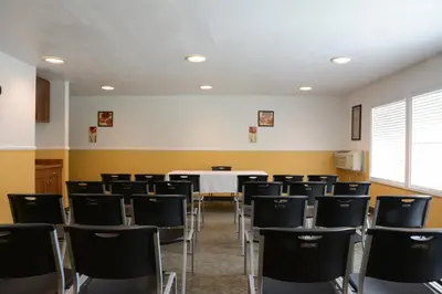 an empty room with a table and chairs at Red Roof Inn San Dimas - Fairplex in San Dimas
