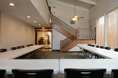 a room with tables and chairs and a staircase at Red Roof Inn San Dimas - Fairplex in San Dimas