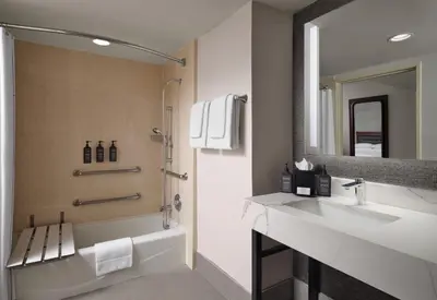 a bathroom with a sink and a mirror at Sheraton Ontario Airport Hotel in Ontario