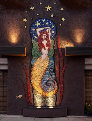 a painting of a mermaid on the side of a wall at Inn at Venice Beach in Los Angeles