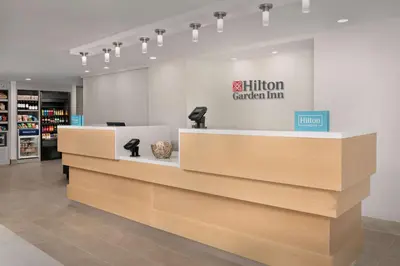 a store with a reception counter with a million garden inn sign at Hilton Garden Inn Los Angeles Marina Del Rey in Los Angeles