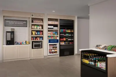 a grocery store aisle with a refrigerator and drinks at Hilton Garden Inn Los Angeles Marina Del Rey in Los Angeles