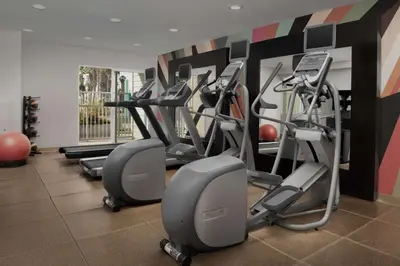 a gym with treadmills and ellipticals in a room at Hilton Garden Inn Los Angeles Marina Del Rey in Los Angeles