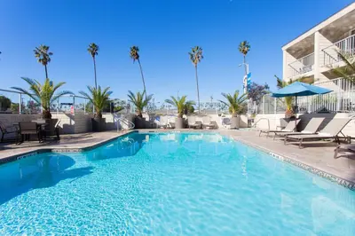 a swimming pool at a hotel with palm trees at Hilton Garden Inn Los Angeles Marina Del Rey in Los Angeles