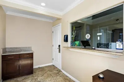 a room with a large mirror and a counter at 3rd Avenue Inn in La Habra