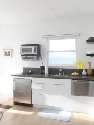 a kitchen with a sink and a microwave at Su Casa at Venice Beach in Los Angeles