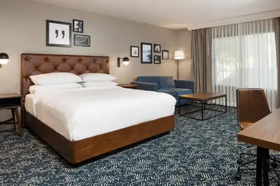 a hotel room with a bed and a desk at Four Points by Sheraton Bakersfield in Bakersfield