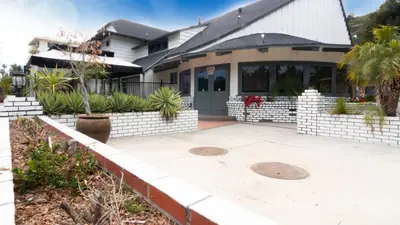 a house with a patio and a driveway at Americas Best Value Inn Rancho Palos Verdes in Rancho Palos Verdes
