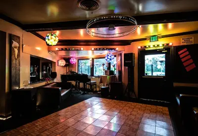a dance floor in a room with a bar at Americas Best Value Inn Rancho Palos Verdes in Rancho Palos Verdes