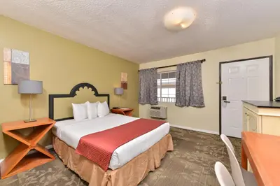 a hotel room with a bed and a kitchen at Americas Best Value Inn Rancho Palos Verdes in Rancho Palos Verdes