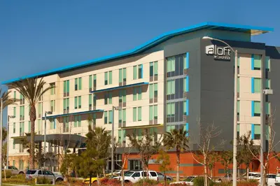 an office building with a sign on it at Aloft Ontario-Rancho Cucamonga in Rancho Cucamonga