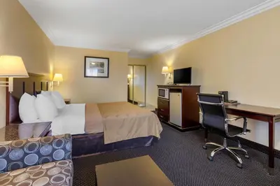 a hotel room with a bed and a desk at Quality Inn - Torrance Lomita in Lomita
