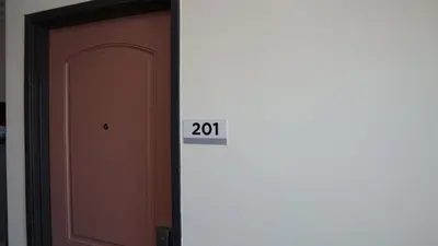 a door with a sign that says next to it at Holly Crest Hotel - Los Angeles, LAX Airport in Inglewood