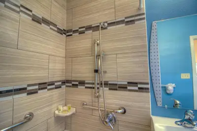 a bathroom with a shower and a sink at Princess Inn in Westminster