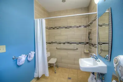 a bathroom with a sink and a shower at Princess Inn in Westminster