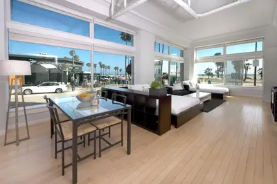a living room with a couch and a table at AIR Venice on the Beach in Los Angeles